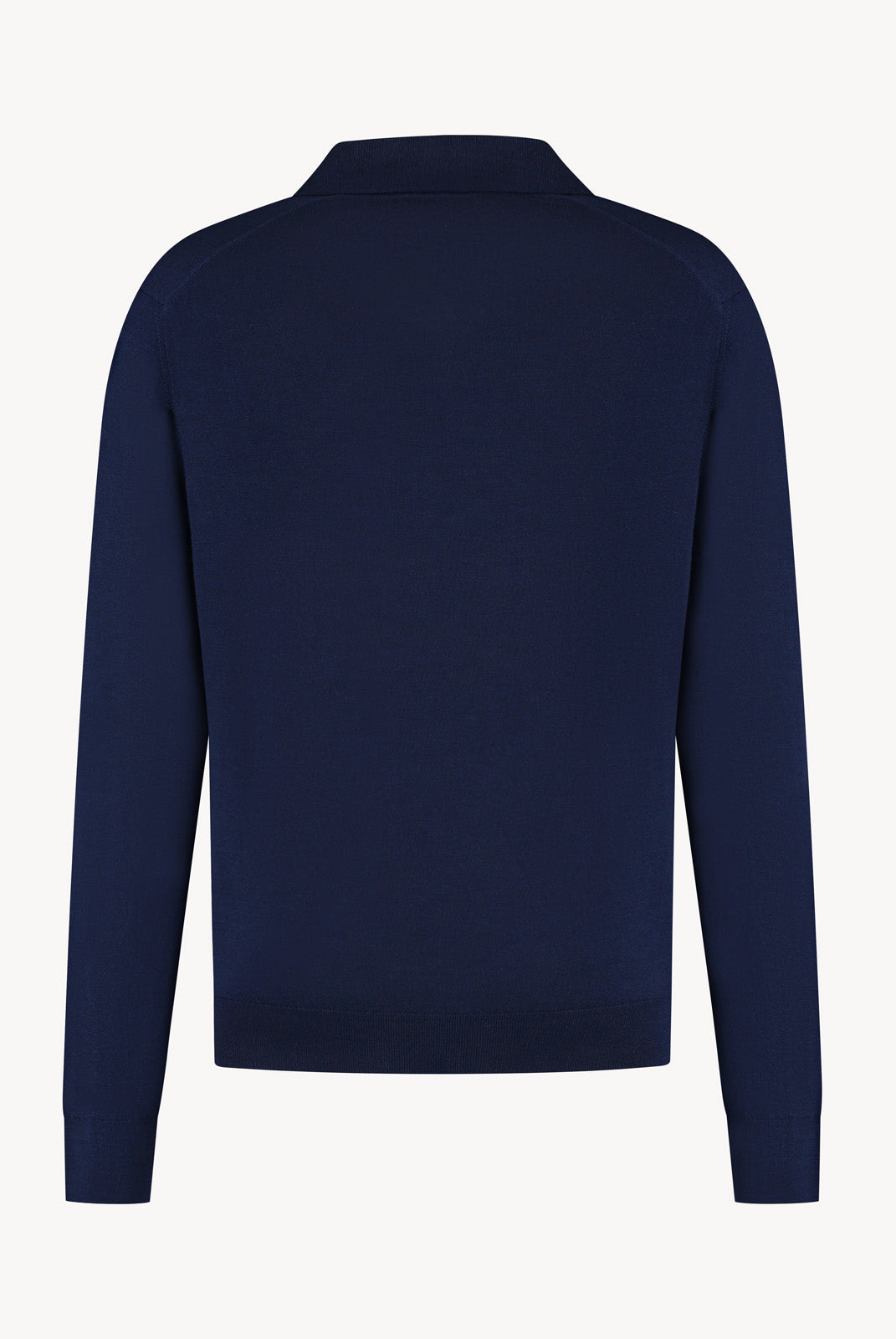 The Observer long-sleeve knitted polo in extra-fine merino wool, shown in Ink Navy, back view.
