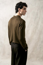 The Observer long-sleeve knitted polo in extra-fine merino wool, shown in Dark Olive, back view on model
