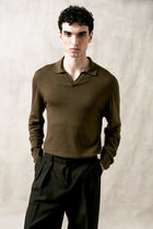 The Observer long-sleeve knitted polo in extra-fine merino wool, shown in Dark Olive, front view on model
