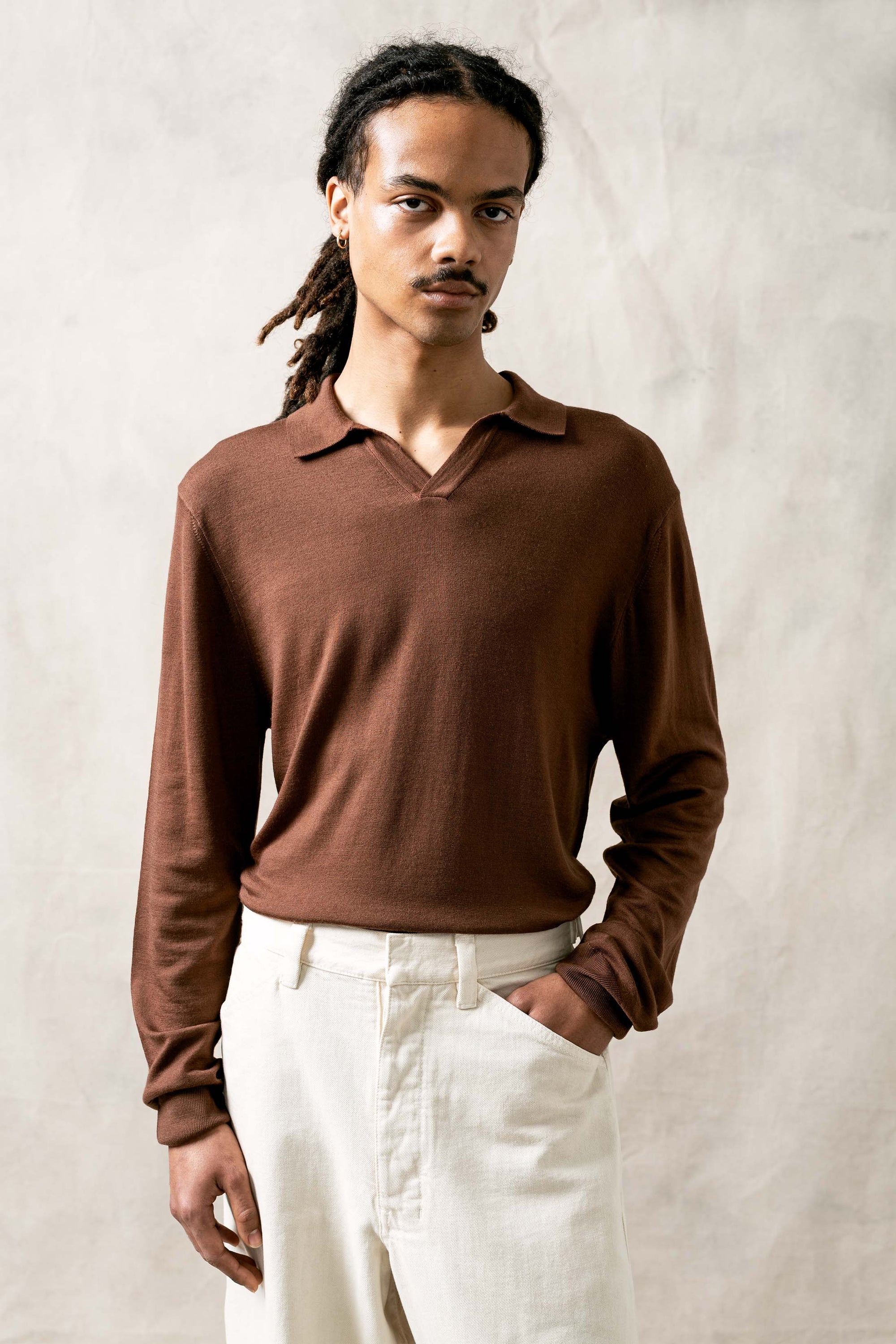 The Observer long-sleeve knitted polo in extra-fine merino wool, shown in Umber Brown, front view on model
